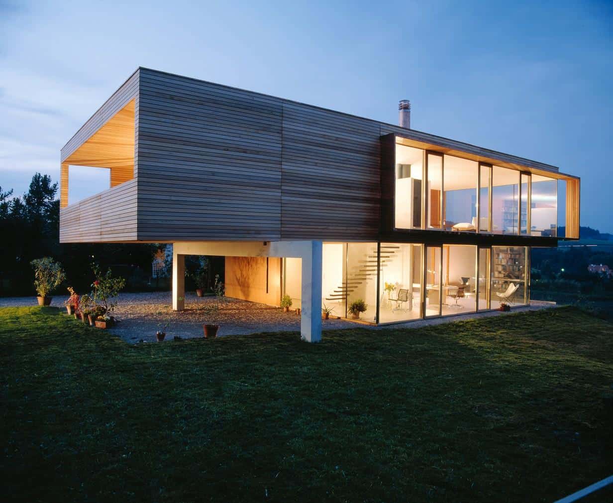 glass-walled-hilltop-house-with-private-wooden-upper-volume-1-angle-facade